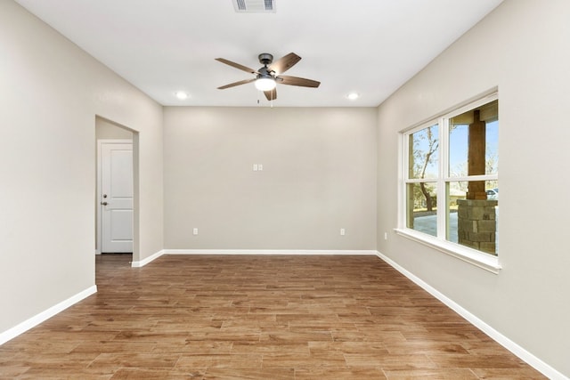 unfurnished room featuring ceiling fan and light wood-type flooring