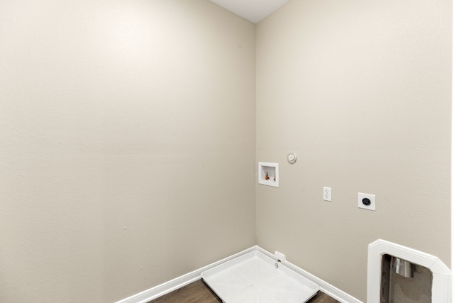 washroom with electric dryer hookup, hookup for a gas dryer, hardwood / wood-style floors, and washer hookup