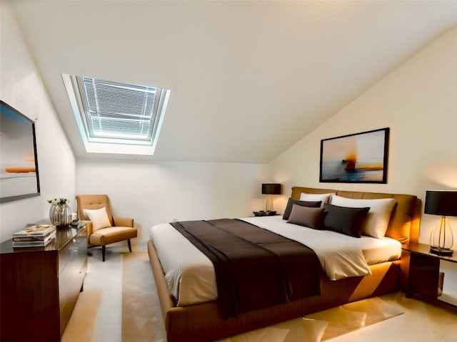 bedroom with vaulted ceiling with skylight