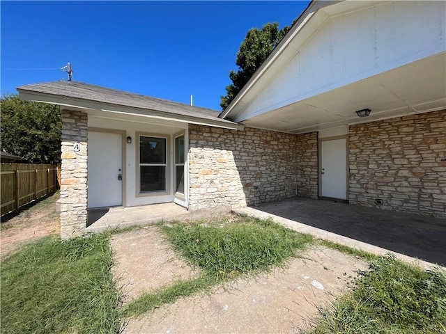 entrance to property with a patio area