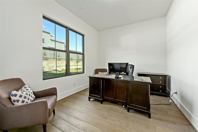 office area with light hardwood / wood-style flooring