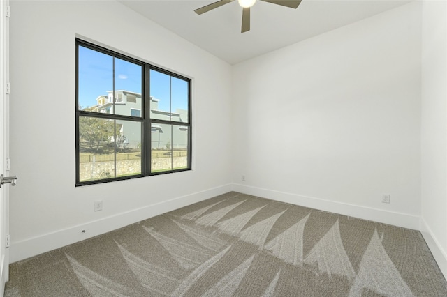 empty room with carpet and ceiling fan