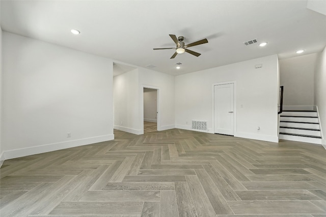 spare room with ceiling fan and light parquet floors