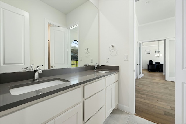 bathroom with double sink vanity and hardwood / wood-style flooring