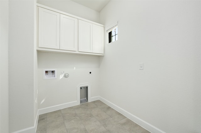 washroom with gas dryer hookup, cabinets, electric dryer hookup, washer hookup, and light tile patterned flooring