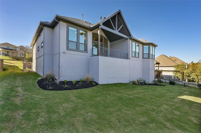 view of side of property with a yard