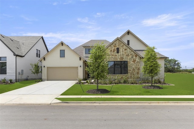 view of front of home featuring a garage and a front yard