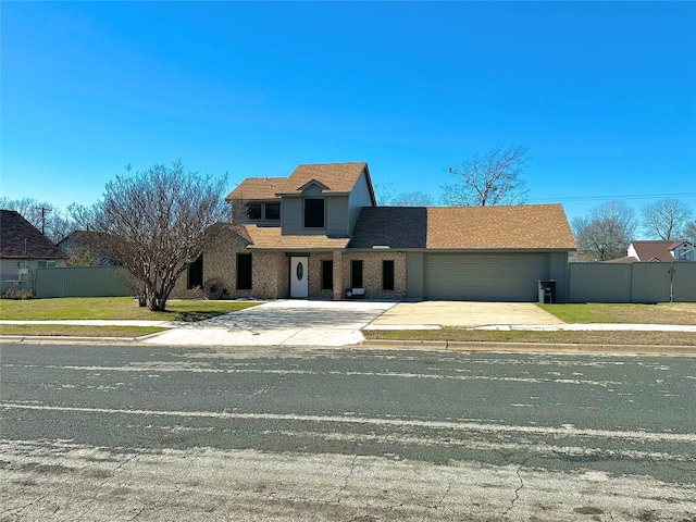 view of property with a front lawn and a garage