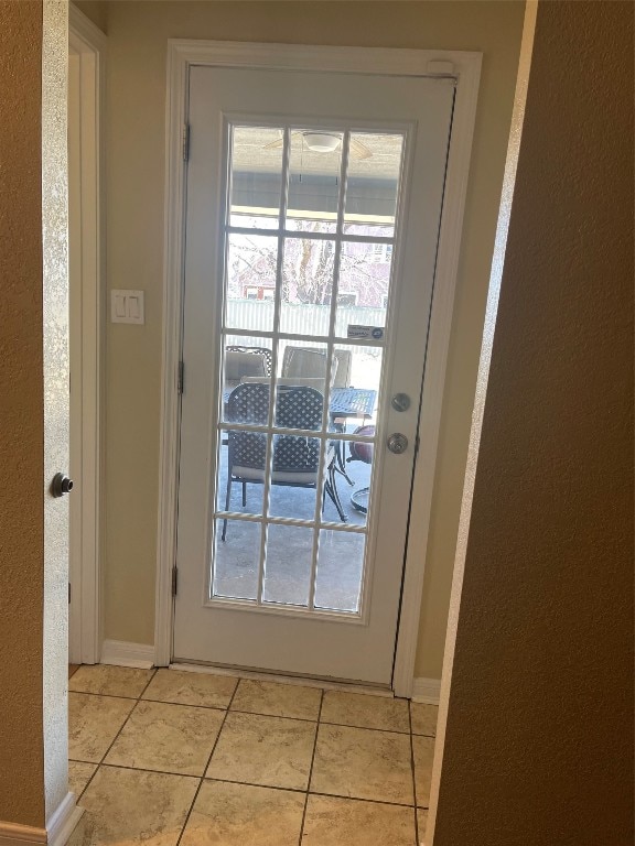 doorway featuring light tile floors