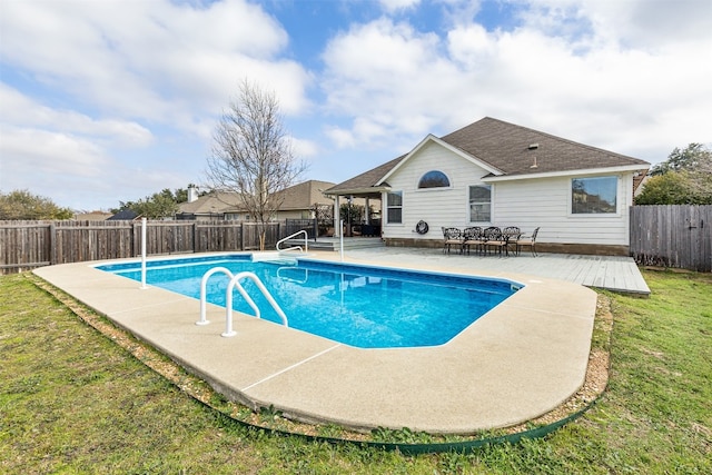 view of swimming pool featuring a yard and a patio