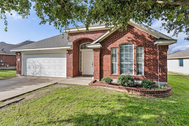 view of front of house with a front yard and a garage