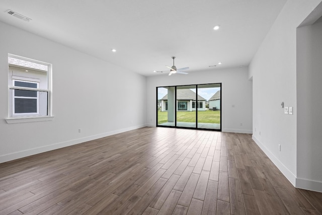 unfurnished room featuring ceiling fan and hardwood / wood-style floors