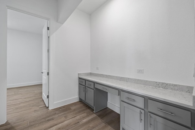 bathroom with wood-type flooring