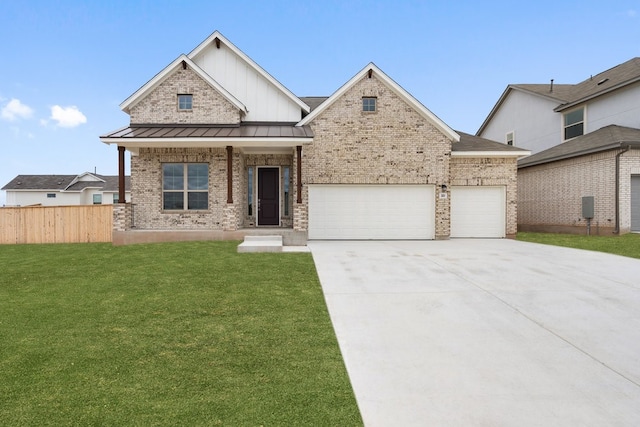 view of front of house featuring a garage and a front lawn