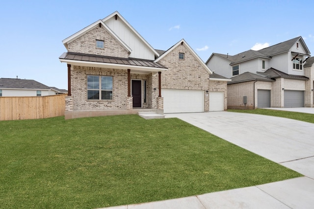 view of front of home with a garage, a front yard, and covered porch