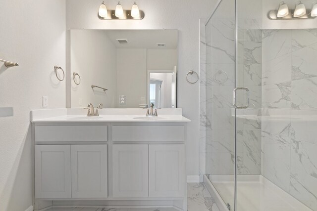 bathroom with vanity and an enclosed shower