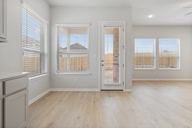 doorway with light hardwood / wood-style flooring