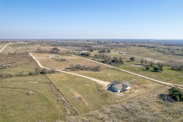 birds eye view of property featuring a rural view