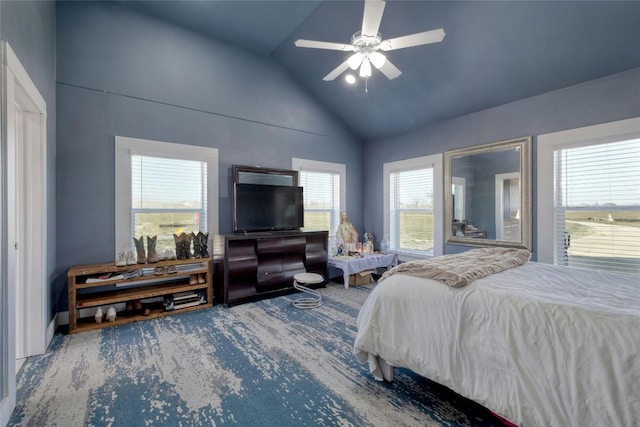 bedroom with ceiling fan and high vaulted ceiling