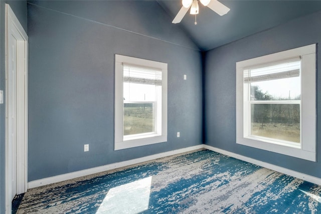 spare room with ceiling fan and vaulted ceiling