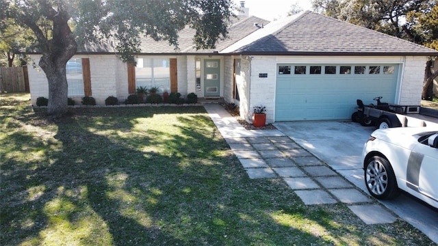 view of front of house featuring a front yard and a garage