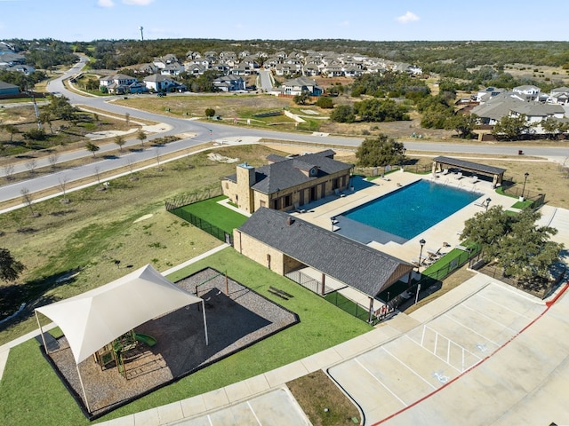 birds eye view of property with a residential view