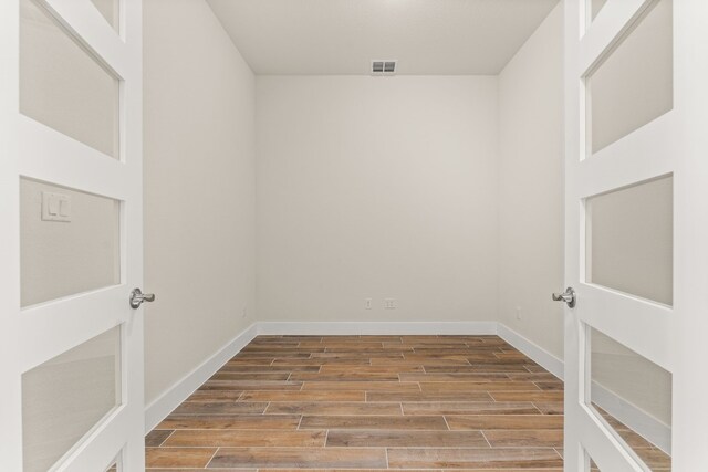 empty room featuring hardwood / wood-style flooring