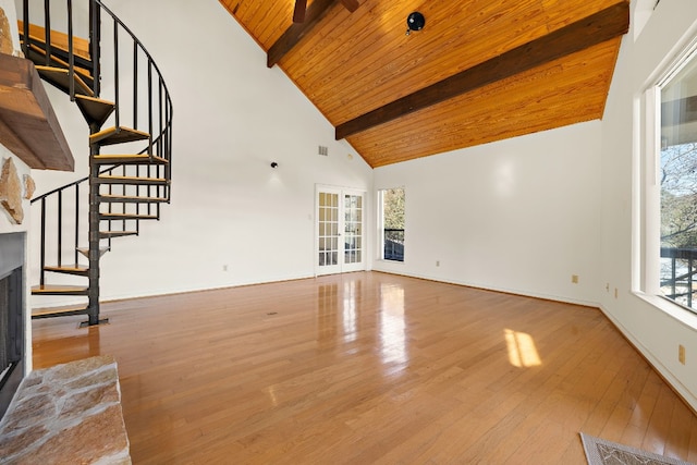 unfurnished living room featuring wooden ceiling, beam ceiling, hardwood / wood-style floors, and high vaulted ceiling