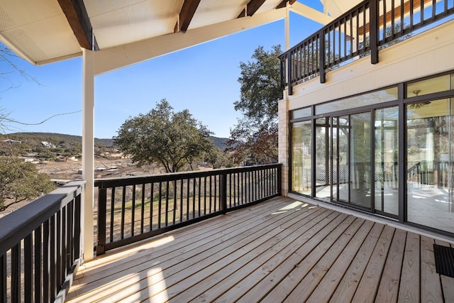 wooden deck with a mountain view