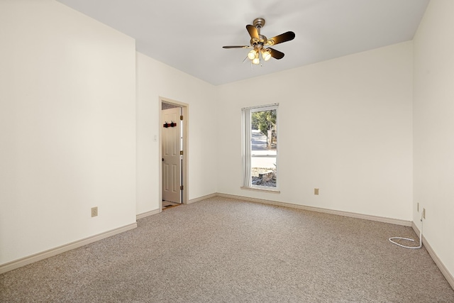 unfurnished room featuring ceiling fan and carpet