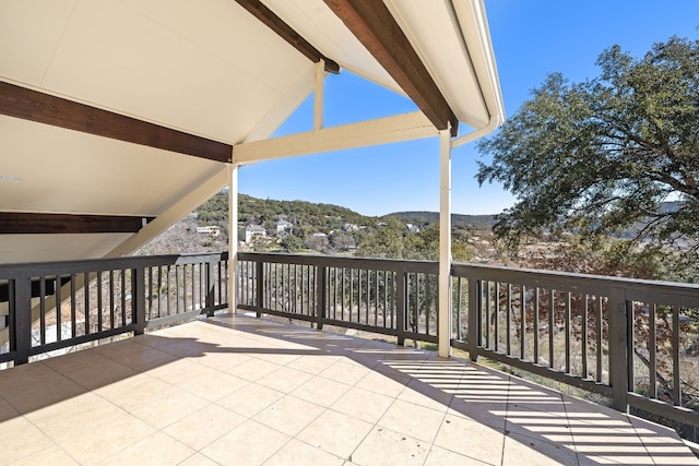 view of patio / terrace featuring a mountain view