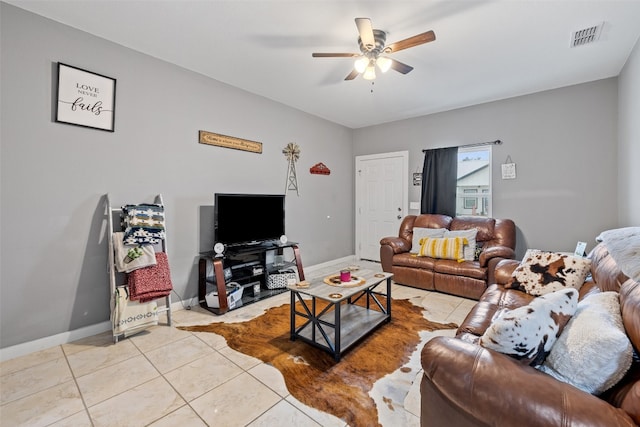 living room with ceiling fan and light tile flooring