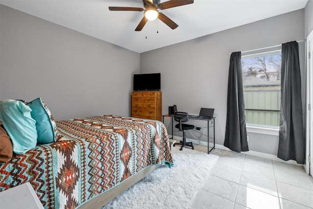 bedroom with ceiling fan and light tile floors