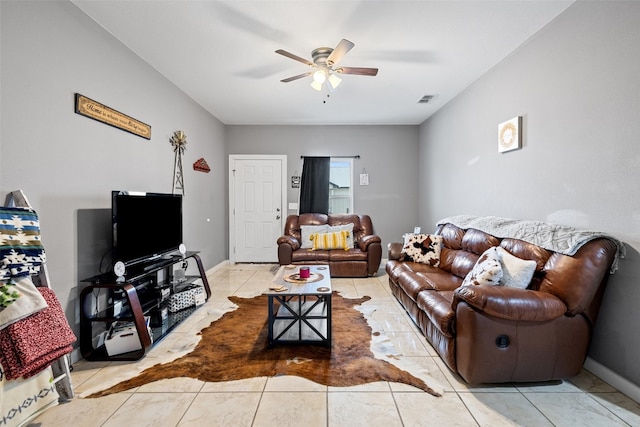 tiled living room featuring ceiling fan