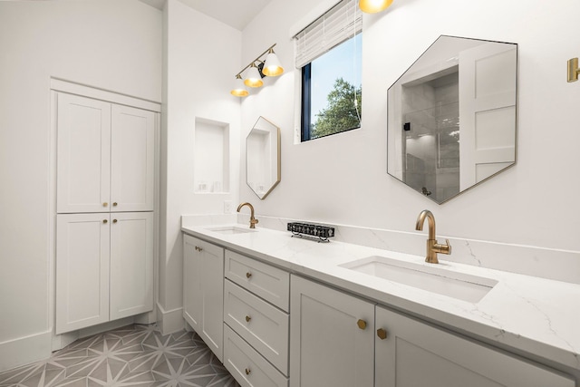 bathroom featuring a shower, tile patterned flooring, and vanity