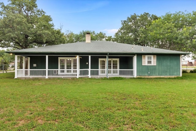 back of house with a yard