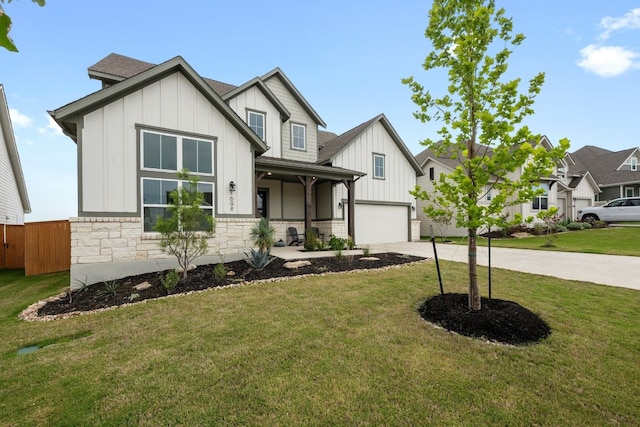 view of front of property featuring a garage, covered porch, and a front lawn