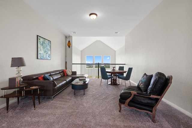 living room featuring carpet and vaulted ceiling