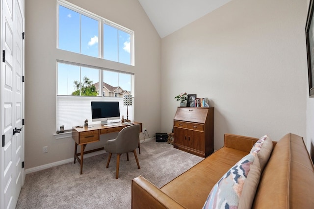 office area featuring light colored carpet and high vaulted ceiling