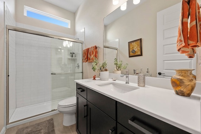 bathroom with vanity, toilet, and a shower with shower door