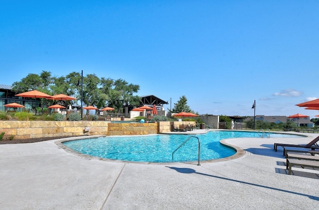 view of pool featuring a patio area