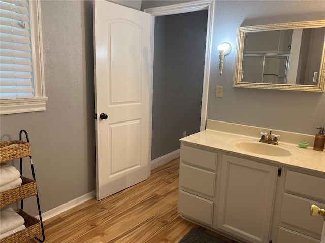 bathroom with vanity and hardwood / wood-style floors