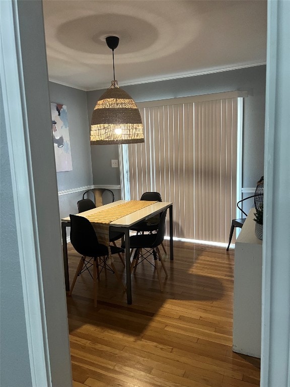 dining room with wood-type flooring