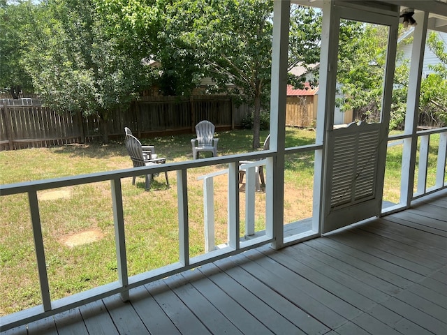 unfurnished sunroom featuring a healthy amount of sunlight