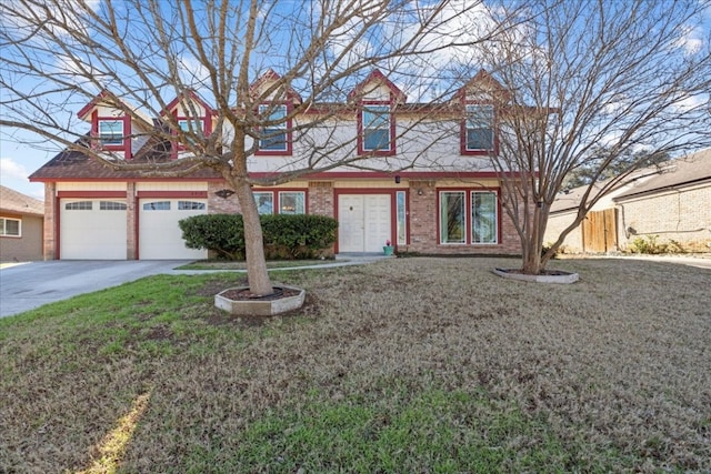 view of front of house with a garage and a front yard