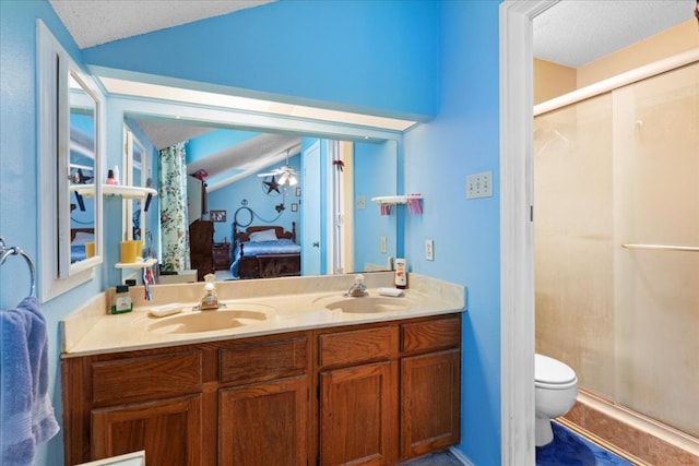 bathroom with double vanity, walk in shower, a textured ceiling, toilet, and vaulted ceiling