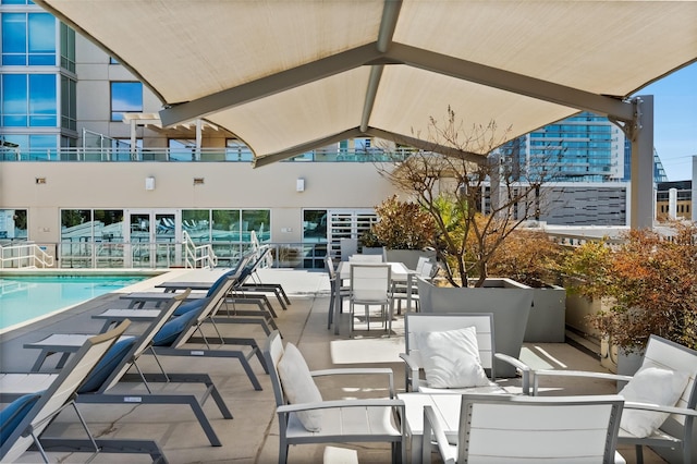 view of patio with a community pool