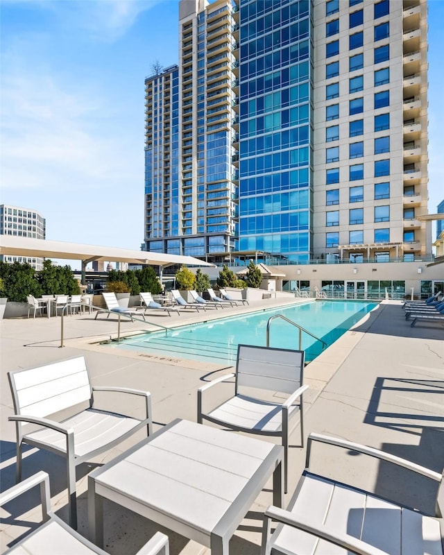 view of swimming pool with a patio area