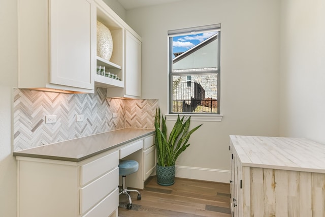 office area with light hardwood / wood-style floors and a wealth of natural light