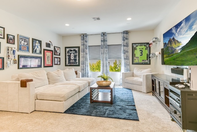 living room with light carpet, visible vents, and recessed lighting